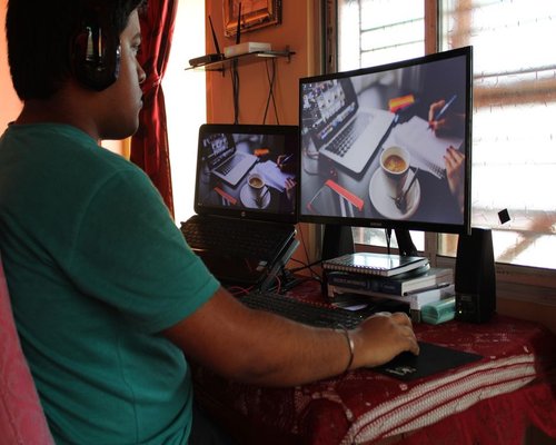 person working on a laptop at home in India