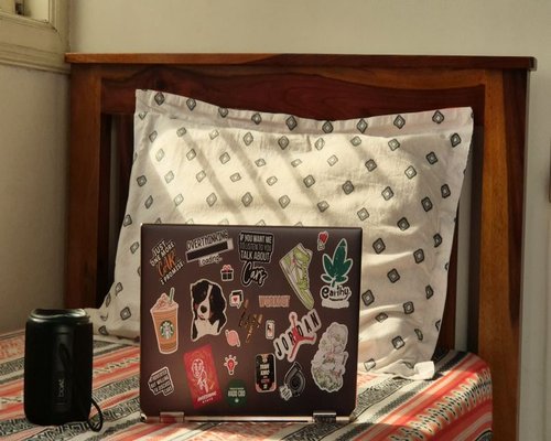 person working on a laptop at home in India